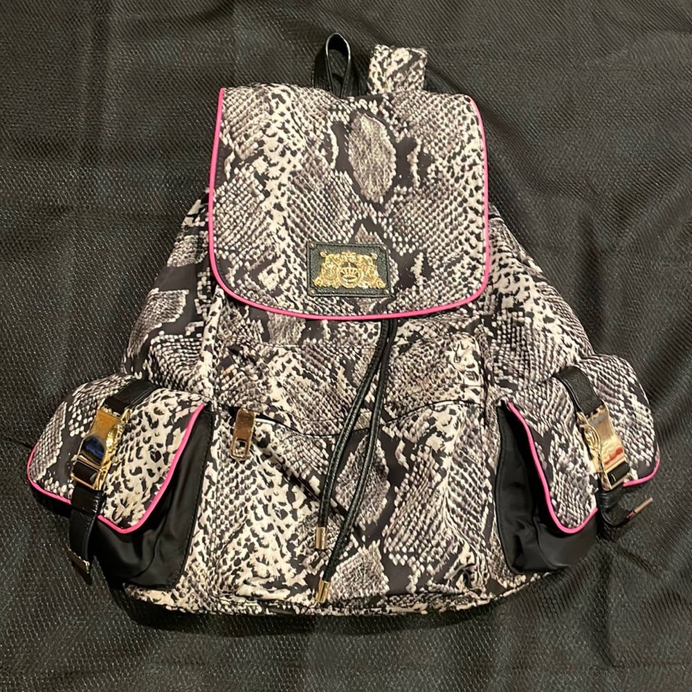 Black and white snake color with pink DKNY backpack